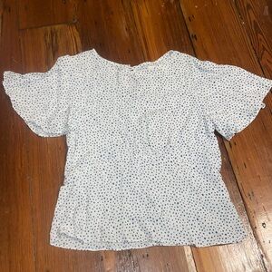 Never worn with out tags white top with blue polka dots size: Girls large